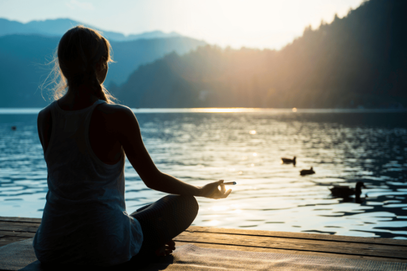 woman meditating with cannabis